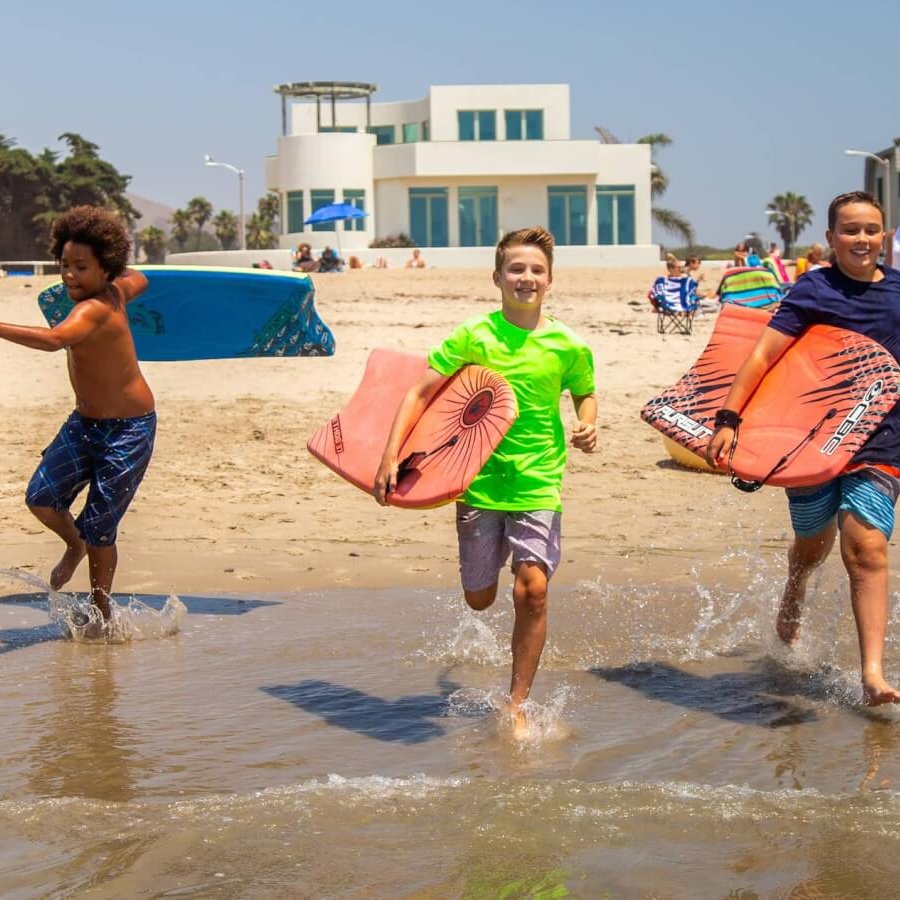 The Ultimate Ventura Travel Guide and California Road Trip Kids playing on ventura state beach