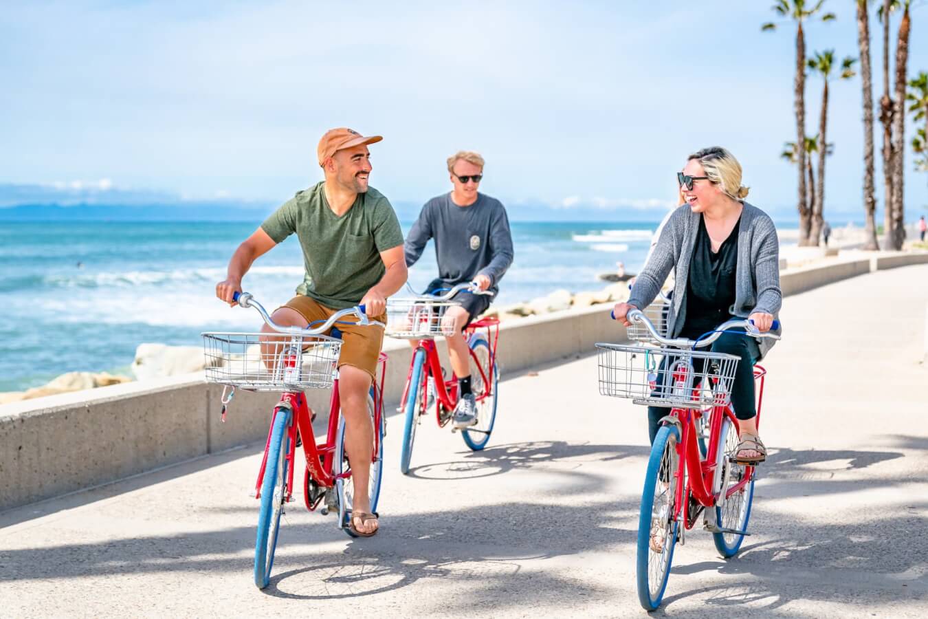 What Can My Family Do in Ventura? Friends riding bikes at surfers point ventura