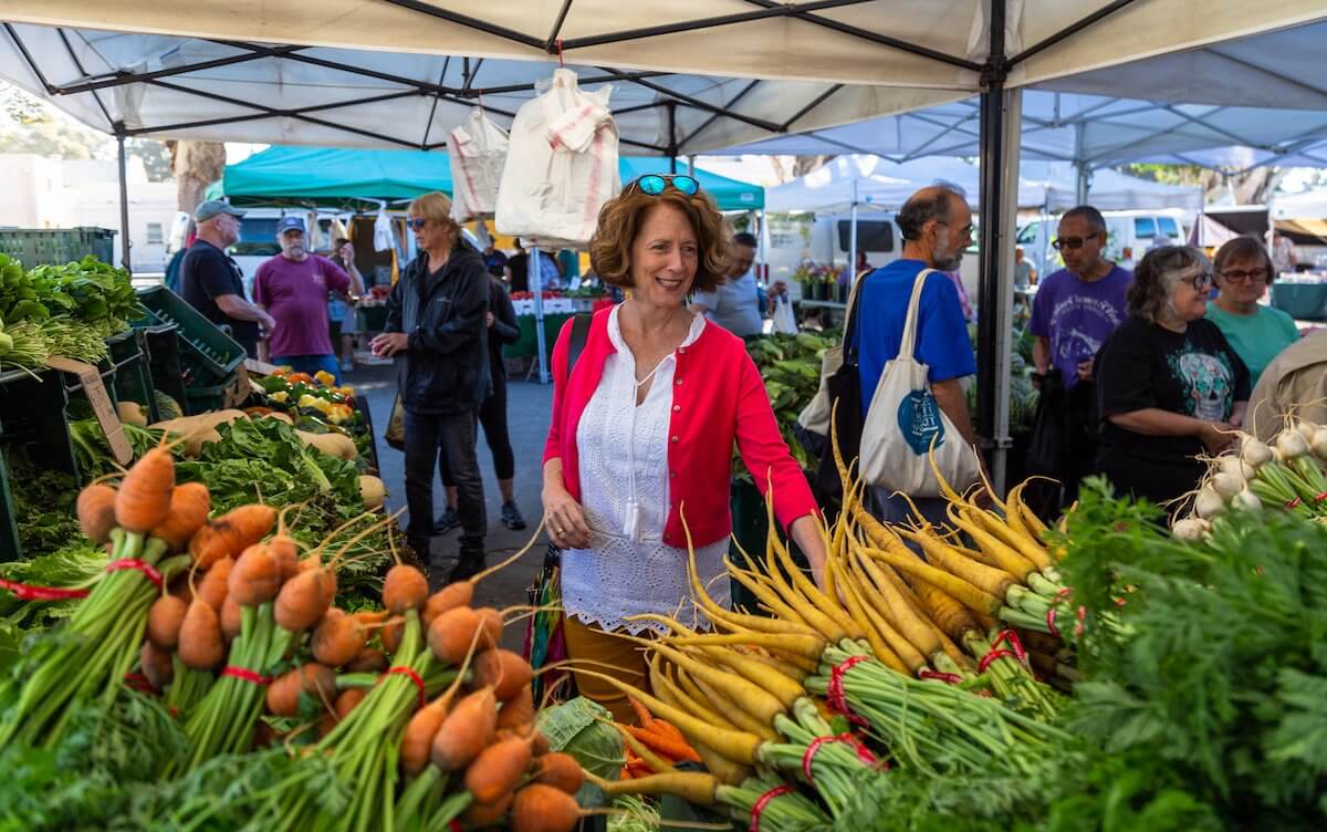 Top 5 Fun Things to Do in Ventura this Weekend March 26th 2022 michele picking carrots at farmers market