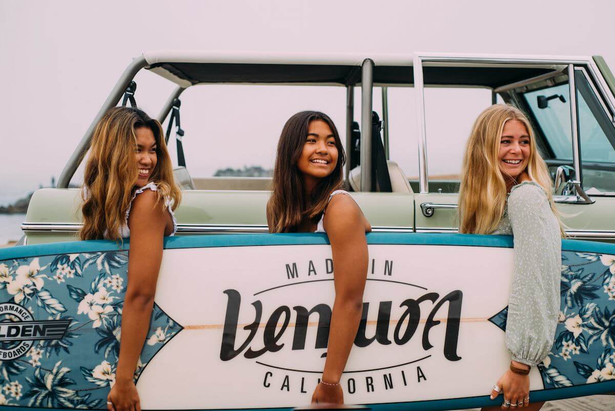 What Can My Family Do in Ventura? girls holding the ventura surfboard