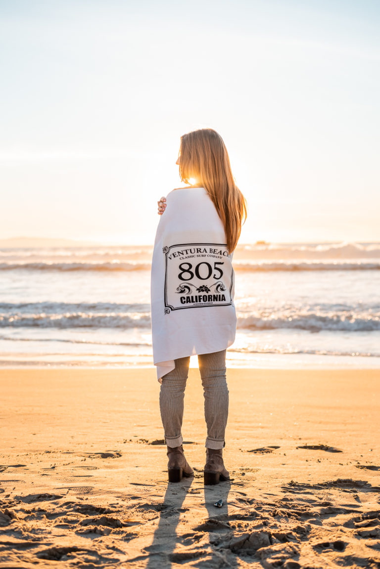 20 Ways to Warm Yourself at Ventura Harbor Woman Wearing 805 Beach Towel at Ventura Harbor