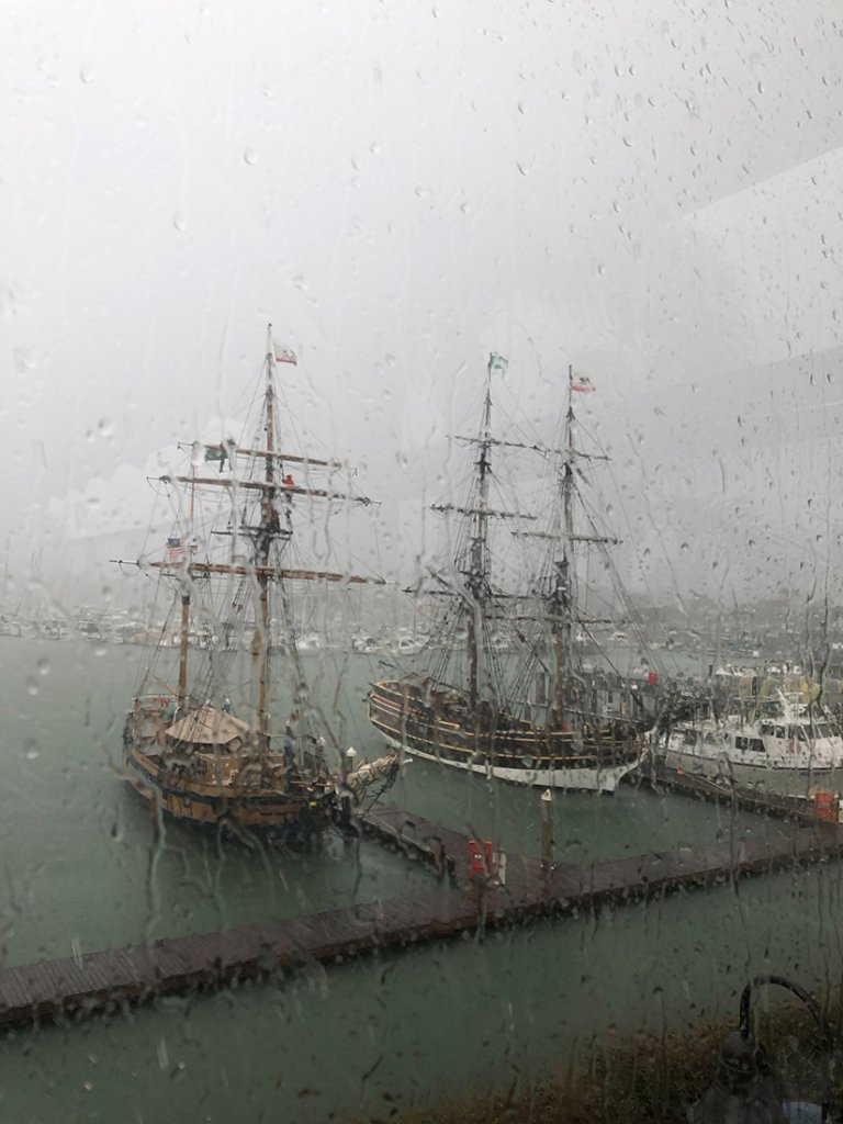 Finding Creative Inspiration in Ventura, California boats on the harbor taken from behind a wet window